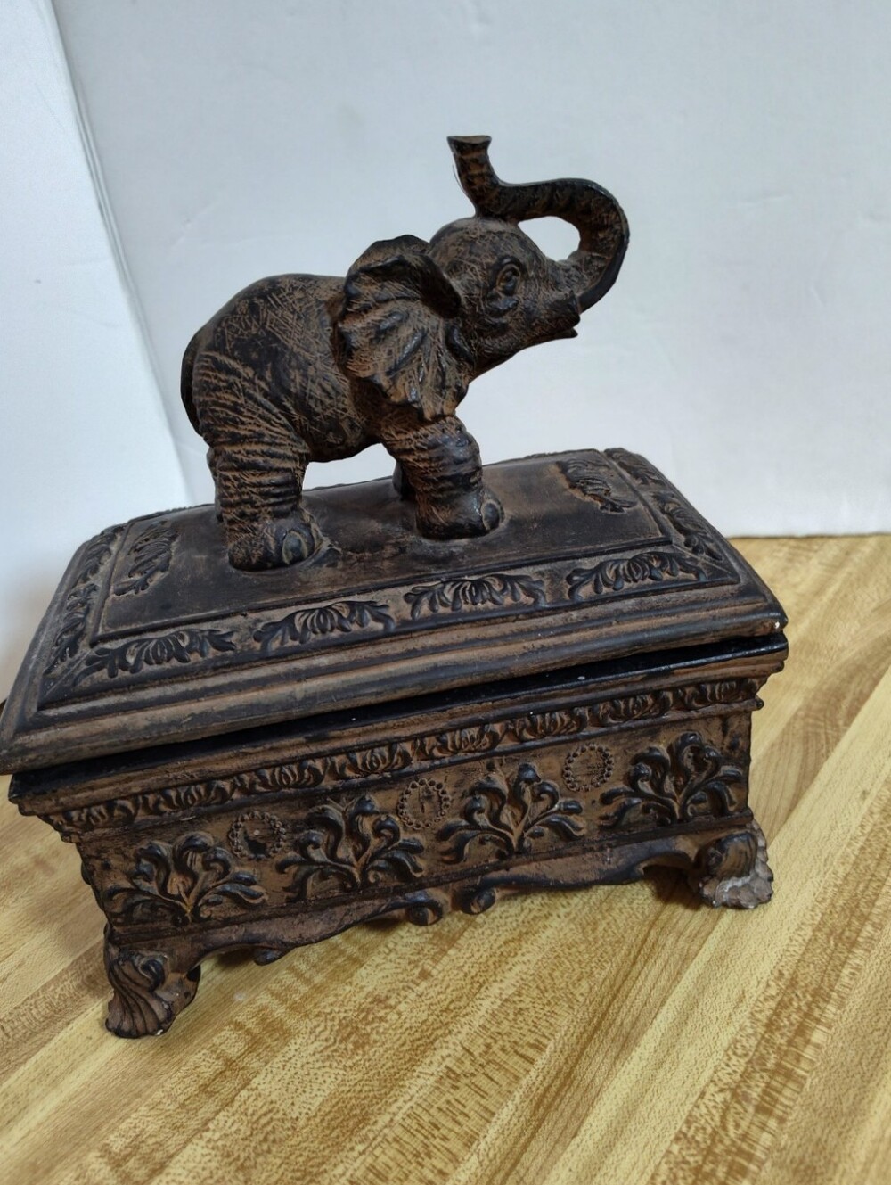 Ornate elephant trinket/jewelry box with raised elephant lid, floral relief desi